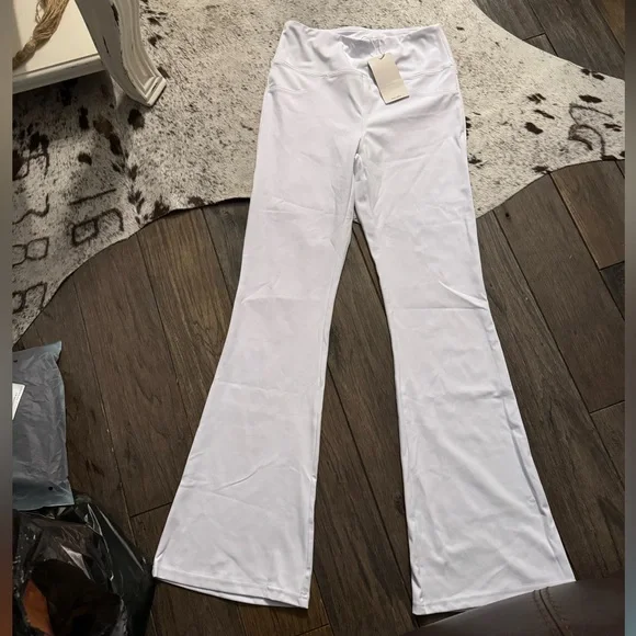 65. Halara High Waisted Back Pocket Flare Yoga Leggings in White - Picture 3 of 4